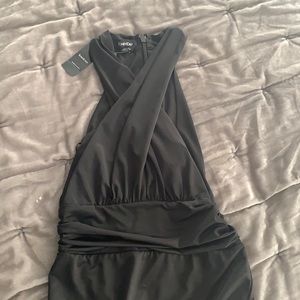 Bebe small black criss cross body suit , zip back , key hole front